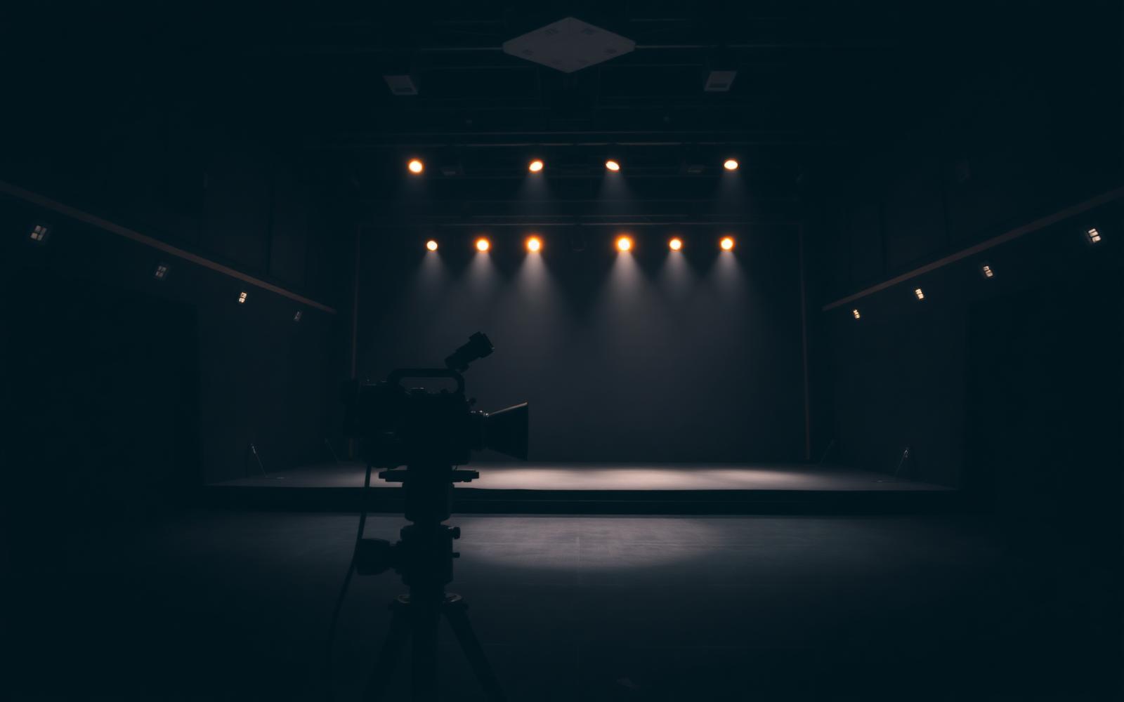 Production stage with spotlights and a camera